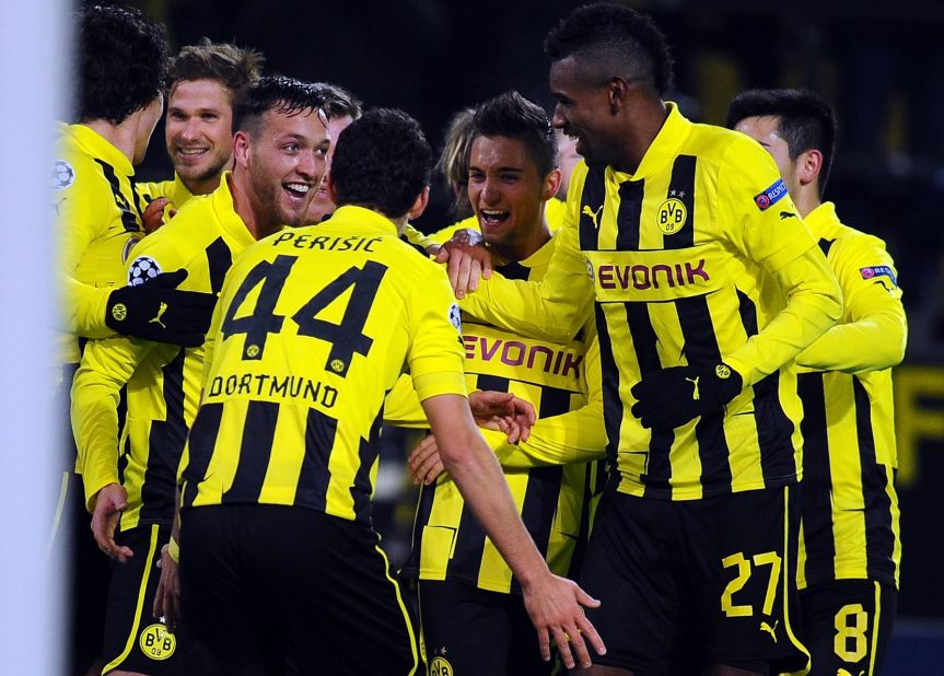 Borussia Dortmund's Julian Schieber celebrates his winner against Manchester City as his team secures top spot in Group D. The Germans finished one point ahead of Real Madrid and will be relishing the knockout phase.