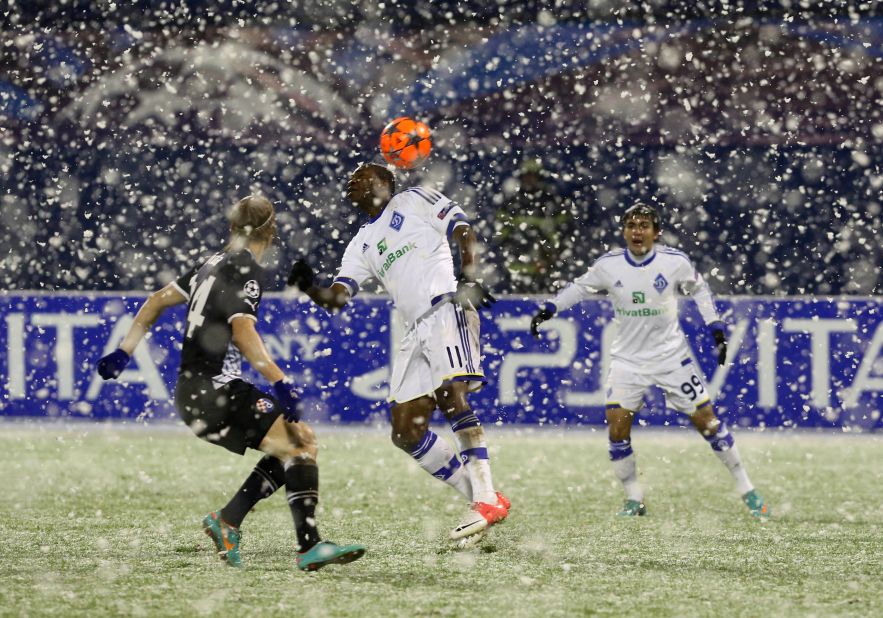 Dynamo Kiev's Ideye Brown fights for the ball with Dinamo Zagreb's Domagoj Vida in a game which was halted after 11 minutes following a snow storm in Croatia. The teams returned to the field after a 17 minute delay and played out a 1-1 draw