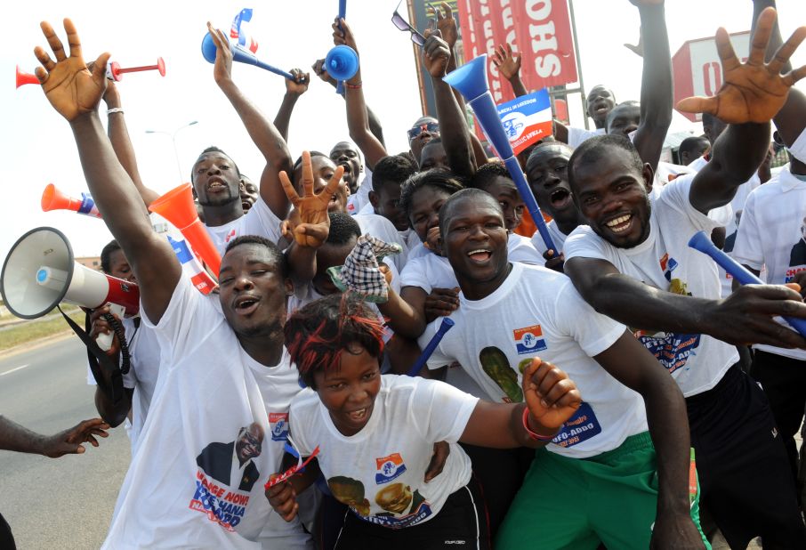 Mahama will be up against NPP candidate, Nana Addo Dankwa Akufo-Addo, who is running for president for the third time, having run in 2008 and 2012.<br /><br />Pictured: NPP supporters dance in the streets of Kasoa in December 2012. Photo Pius Utomi Ekpei/AFP/Getty Images.
