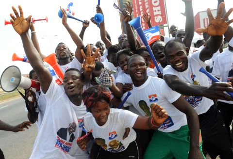 Mahama will be up against NPP candidate, Nana Addo Dankwa Akufo-Addo, who is running for president for the third time, having run in 2008 and 2012. <br /><br />Pictured: NPP supporters dance in the streets of Kasoa in December 2012.