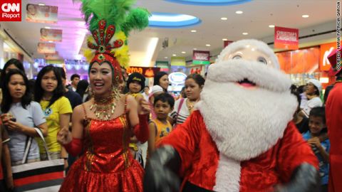 A wacky Christmas parade with dancers, mascots and of course <a href="http://ireport.cnn.com/docs/DOC-889604">Santa Claus</a> caught iReporter Patricia Garcia's eye during a shopping trip to a local mall. 