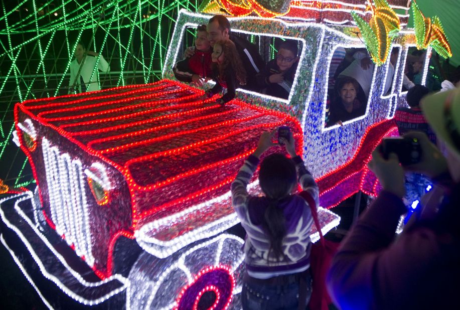 An unusal array of Christmas lights envelop a truck in the city of Medellin, Colombia.