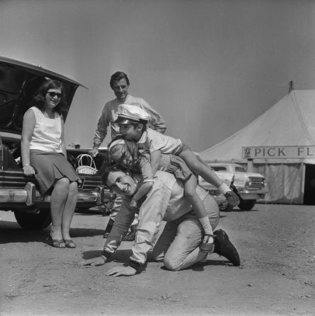 Former world champion Jackie Stewart, seen here playing with the children of F1 rival Graham Hill, was remarkably friendly with his peers, Tu says. "He was incredibly fond of a number of people who drove with him. That partly is because there was a clearer distinction of him being a number one and them being number two drivers."