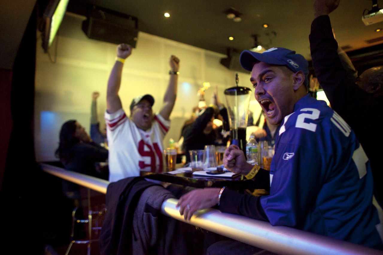 <strong>February 5: </strong>Football fans watch the New York Giants take on the New England Patriots in Super Bowl XLVI at Tonic Bar in New York. The Giants defeated the Patriots 21-17.