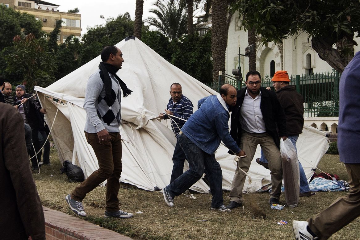 Members of the Muslim Brotherhood and Morsy supporters destroy tents of anti-Morsy protesters outside the presidential palace on December 5.