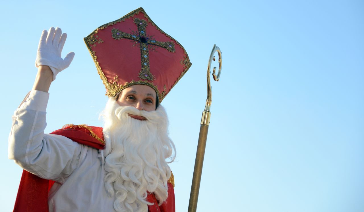 A man dressed as a Santa Claus waves at the port in Hamburg, Germany, on December 6.