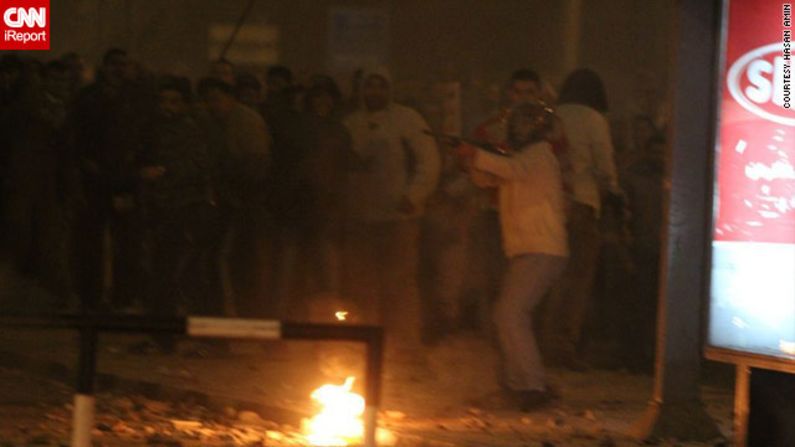 On December 5, pro- and anti-Morsy protesters fought bloody battles on the streets outside the palace. Several deaths have been reported and hundreds of people have been injured, authorities say.  iReporter Hasan Amin said <a href="http://ireport.cnn.com/docs/DOC-891413">in this image</a>, a pro-Morsy supporter pointed what appears to be a rifle at protesters on the opposing side. The military rolled tanks into protest flashpoint areas, but many fear more violence ahead of a planned constitutional referendum on December 15.
