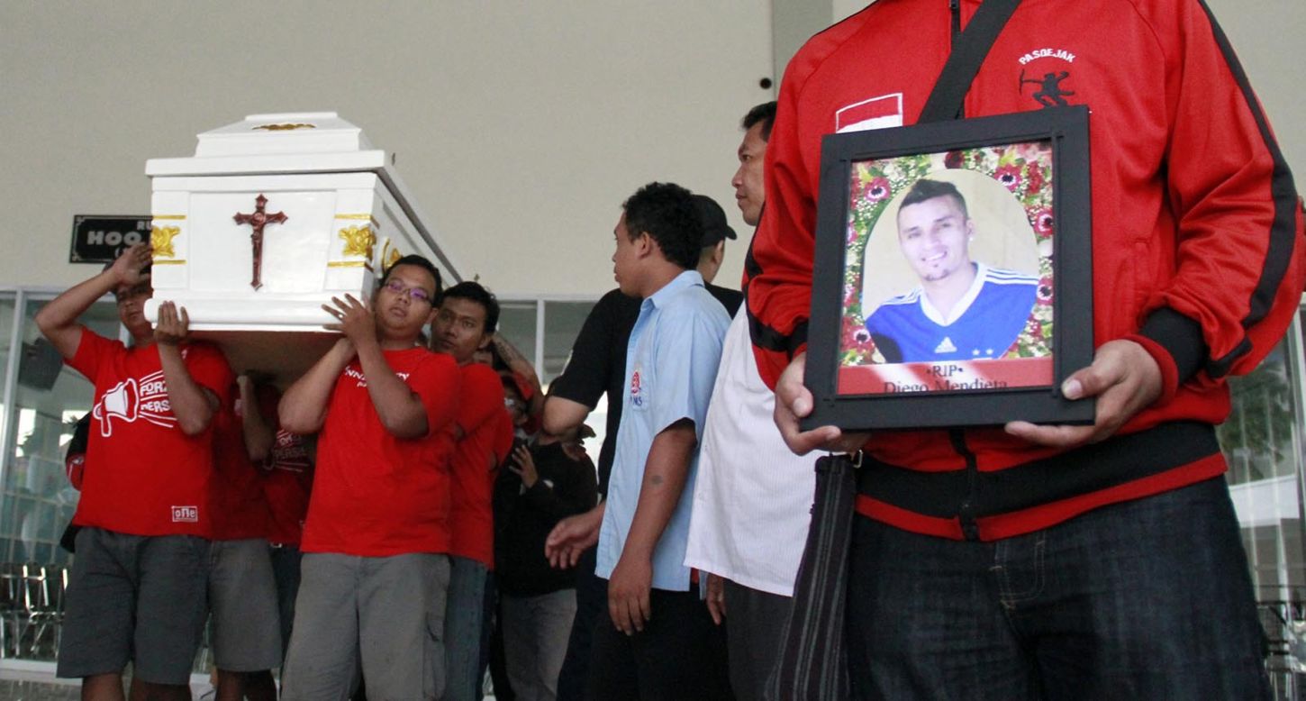 Diego Mendieta's former teammates carry his coffin at the Paraguayan footballer's funeral in Solo, Indonesia. 