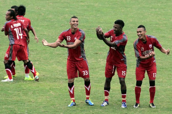 Mendieta (left) celebrates with Persis Solo teammates Romuald Noah and Yanuar Ruspuspito after scoring in a match against Persip Pekalongan.