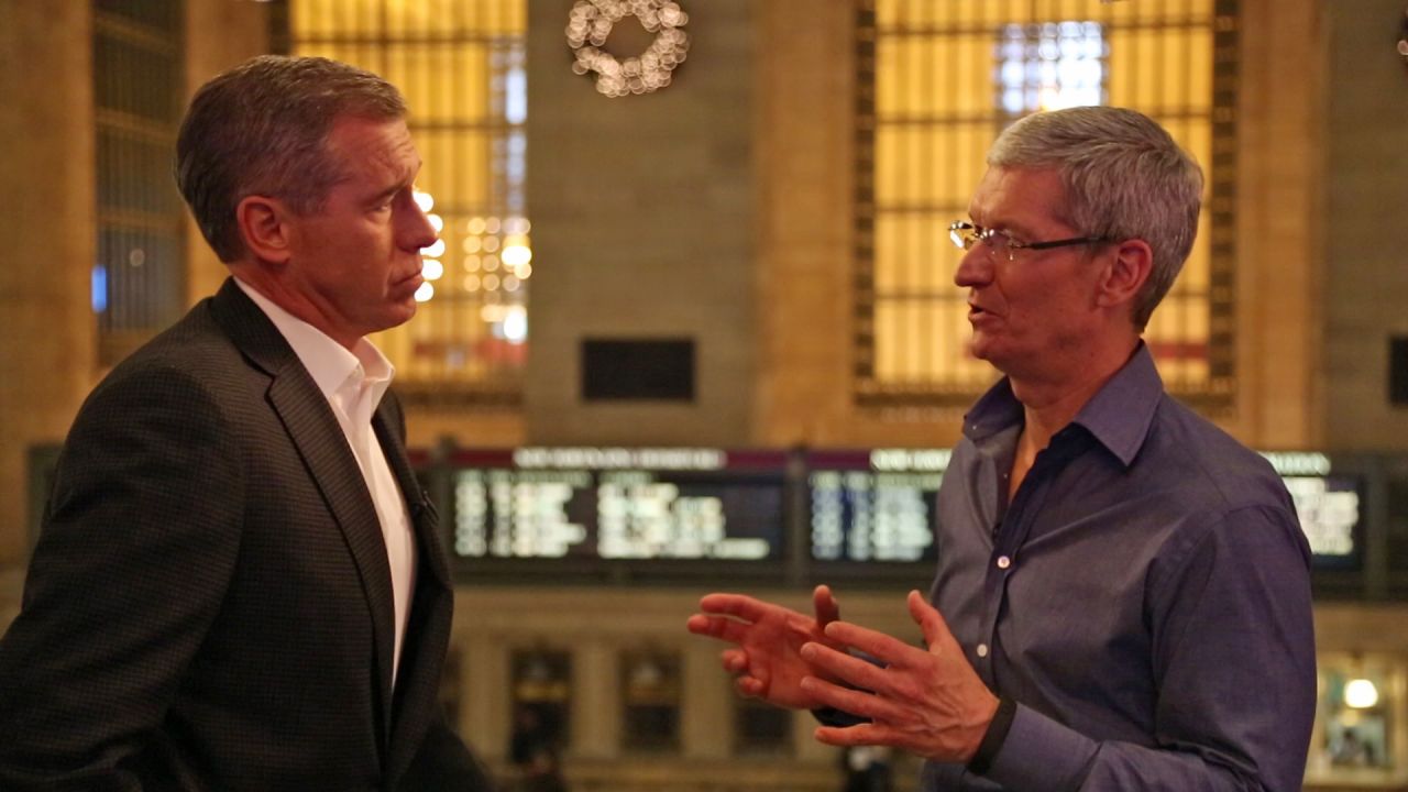 Apple CEO Tim Cook, right, chats with NBC News' Brian Williams outside the Apple store in New York City's Grand Central Station.