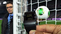 A FIFA official displays new goal-line technology, developed by GoalRef, for the press in Yokohama on December 5, 2012 ahead the Club World Cup football tournament beginning on December 6. The wrist watch displays 'goal' and vibrates whenever the ball enters the goal. Referees can reject the use of goal-line technology or even overrule it in the Club World Cup, which starts this week in Japan, a senior FIFA official said on December 5. AFP PHOTO / Yoshikazu TSUNO (Photo credit should read YOSHIKAZU TSUNO/AFP/Getty Images) 