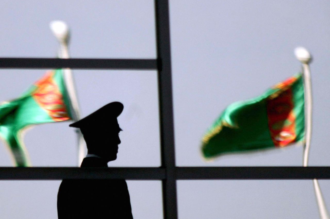 A Turkmen policeman stands in front of the People's Congress in 2007.
