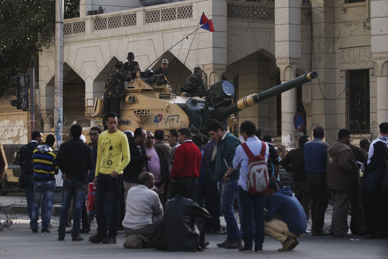 Protesters are blocked from approaching the the presidential palace by the Egyptian army on December 6 in Cairo.