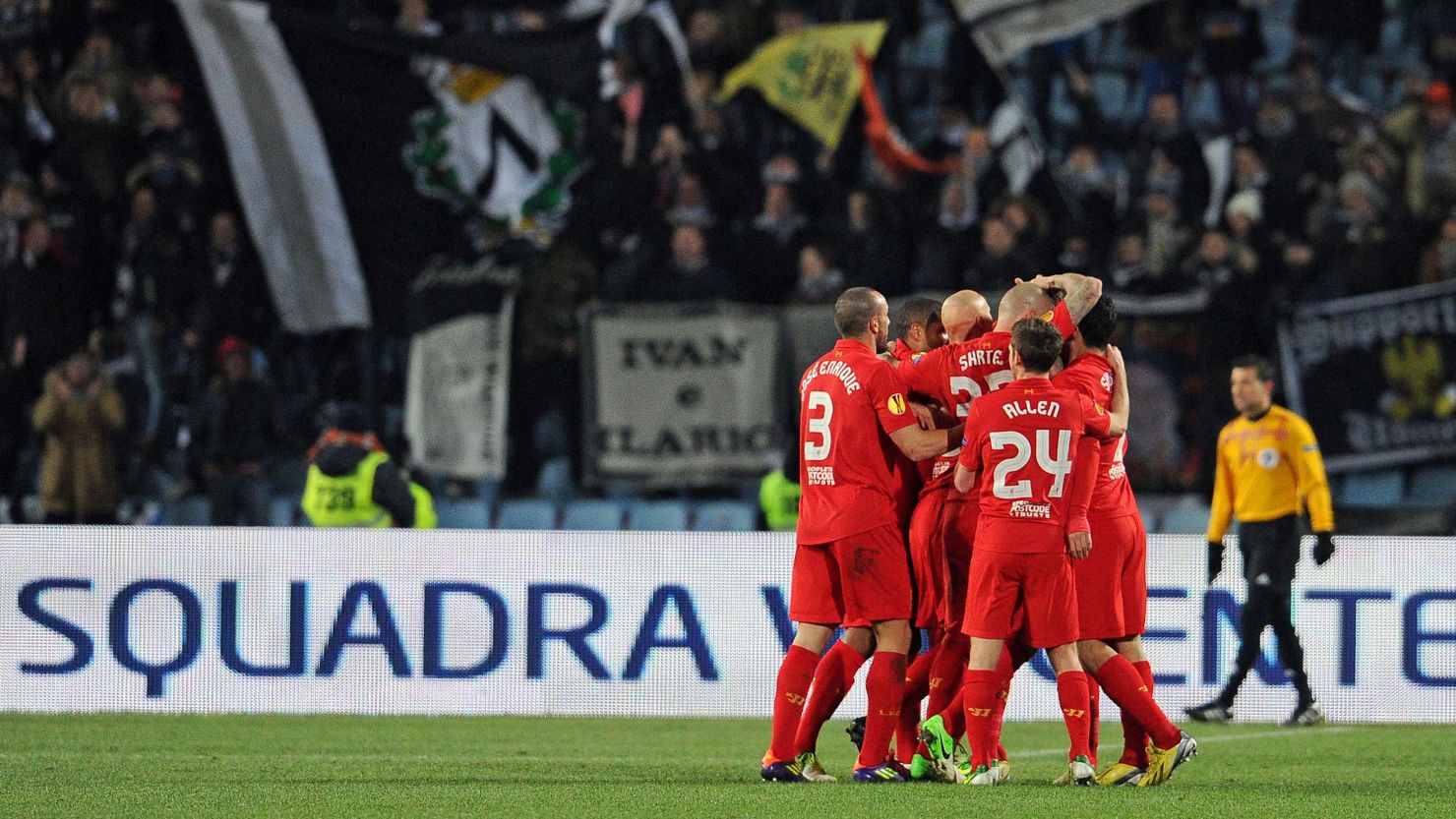 Liverpool's Jordan Henderson is mobbed after scoring the decisive goal in the 1-0 win over Udinese in Italy. 
