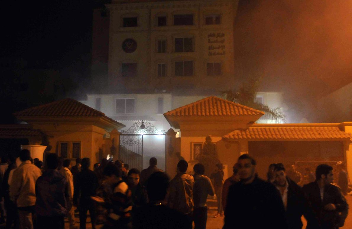 Protesters angry over Morsy's decisions giving himself unchecked powers surround the Muslim Brotherhood's headquarters in Cairo after starting a fire inside the compound on Thursday, December 6.
