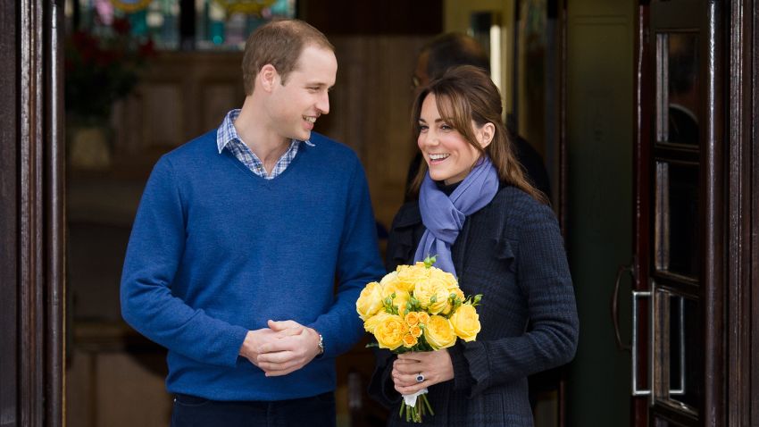 Britain's Prince WiIliam, the Duke of Cambridge, (L) poses for pictures with his wife Catherine, Duchess of Cambridge, as they leave the King Edward VII hospital in central London, on December 6, 2012. 