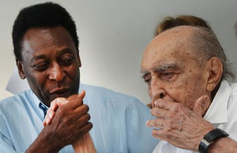 Brazilian football legend Edson Arntes do Nascimento, known as Pele, kisses Niemeyer's hand on November 4, 2010, in Rio de Janeiro during a press conference. Niemeyer was in charge of the design for a Football Museum in Santos.
