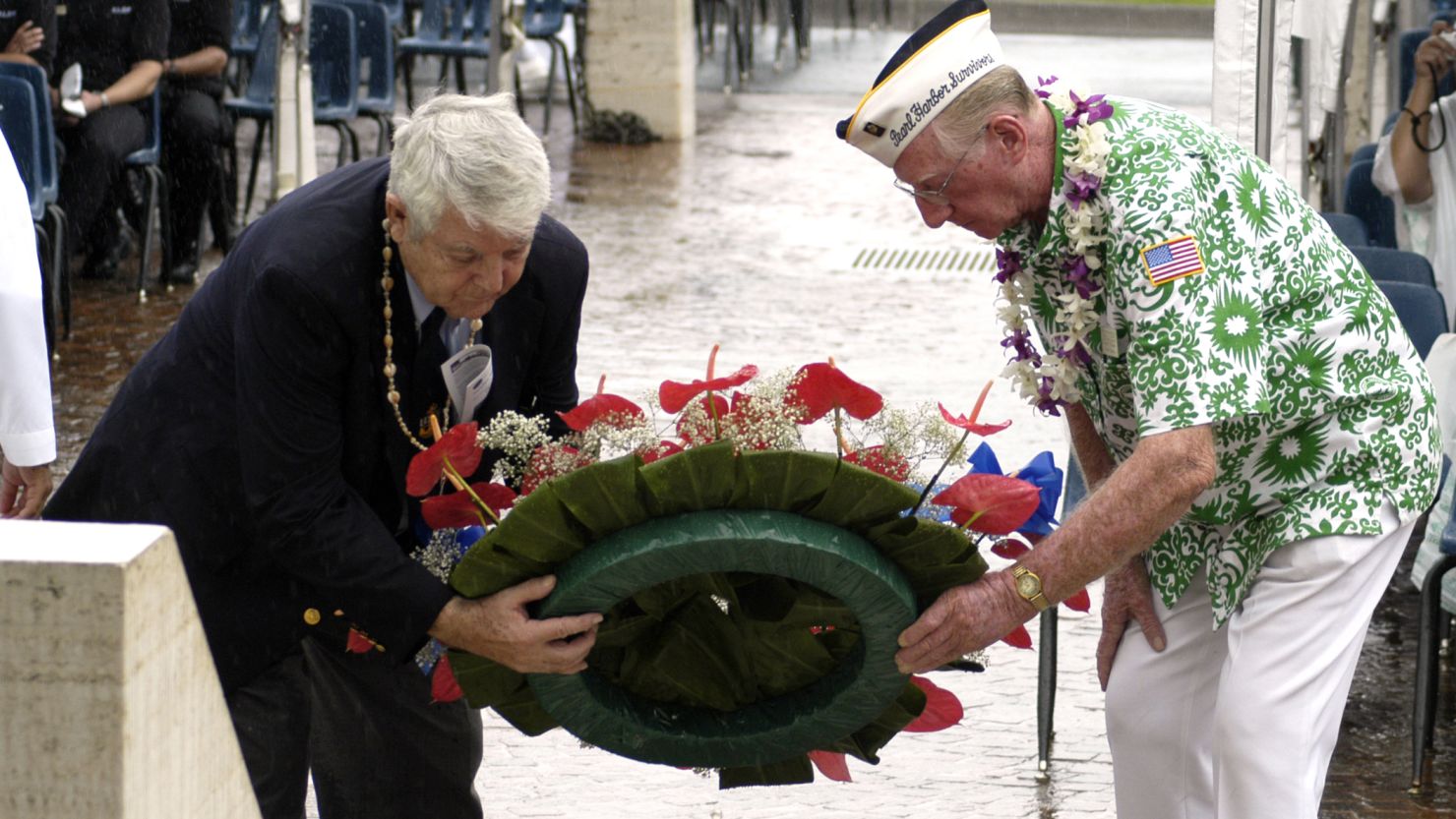 Ray Emory, left, and Bob Kinzler of the Pearl Harbor Survivors Association lay a wreath in 2003 to honor those killed in the attack.