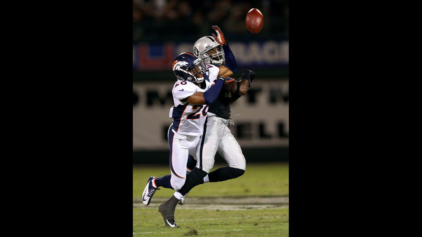 Rahim Moore of the Denver Broncos breaks up a pass intended for Denarius Moore of the Oakland Raiders on Thursday.