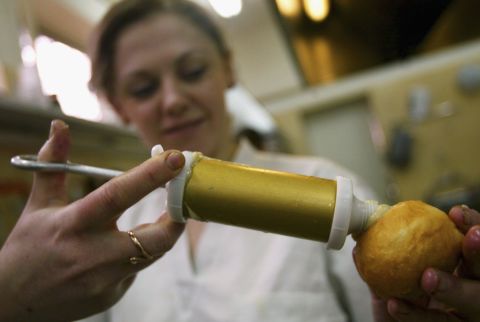 In Jewish tradition, it is customary to eat doughnuts and other foods fried in oil during the eight-day festival of Hanukkah.In this picture, a kosher bakery prepares doughnuts by injecting them with cream custard in the Ukranian port city of Odessa. A thriving Jewish community in the region ensures that there is plenty of demand for kosher foodstuffs. 