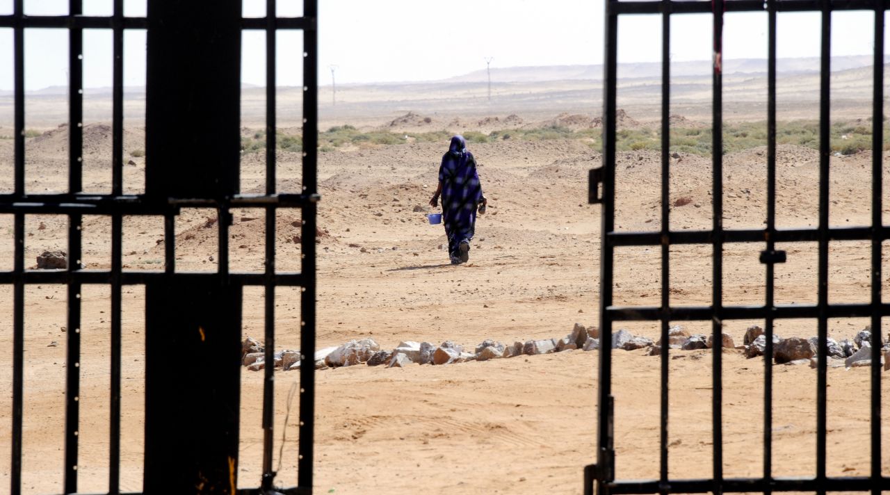 A Sahrawi woman walks in the desert in March 2011 near the Western Sahara refugee camp in Tindouf.