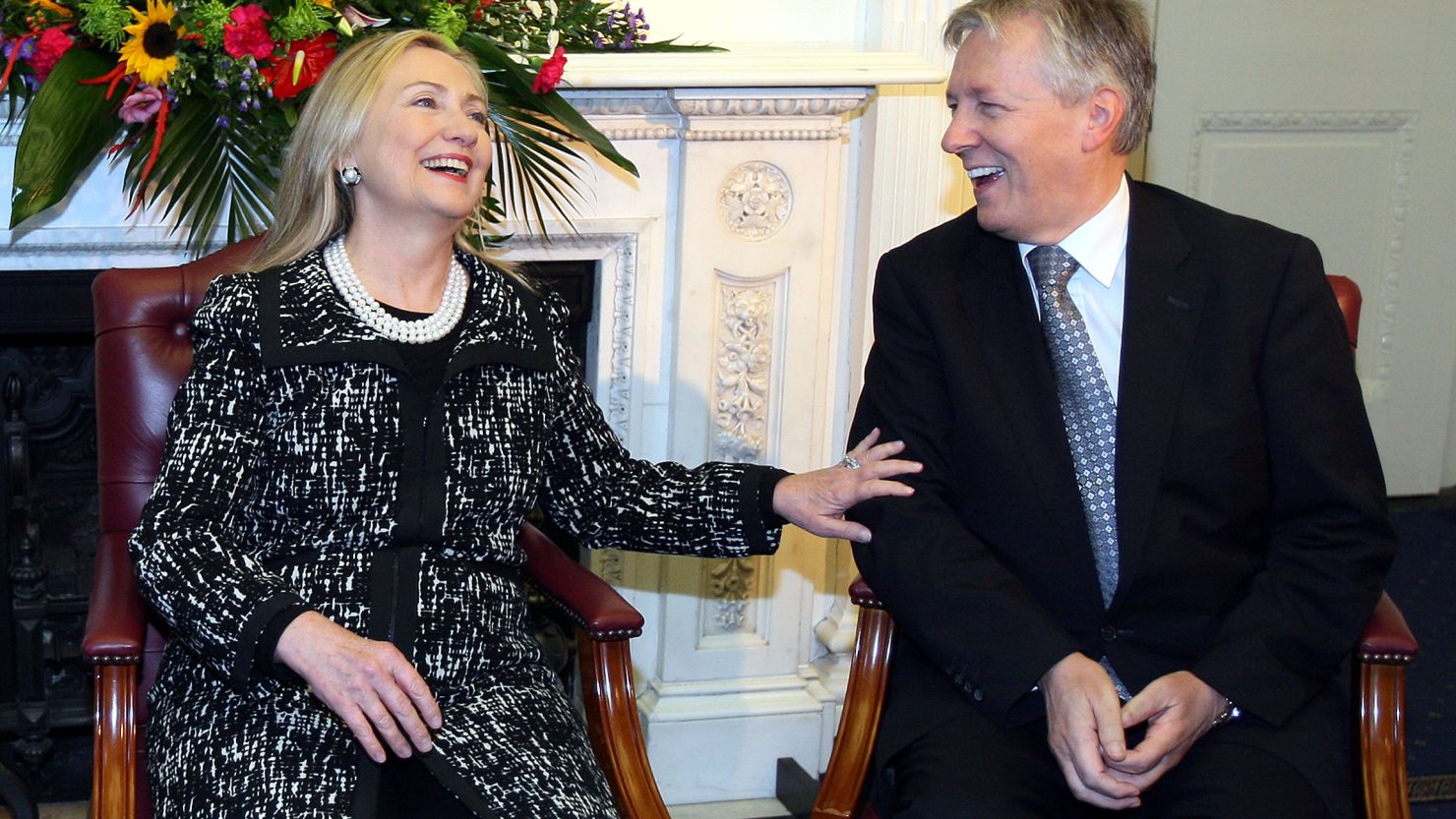 U.S. Secretary of State Hillary Clinton talks with Northern Ireland First Minister Peter Robinson in Belfast on Friday.