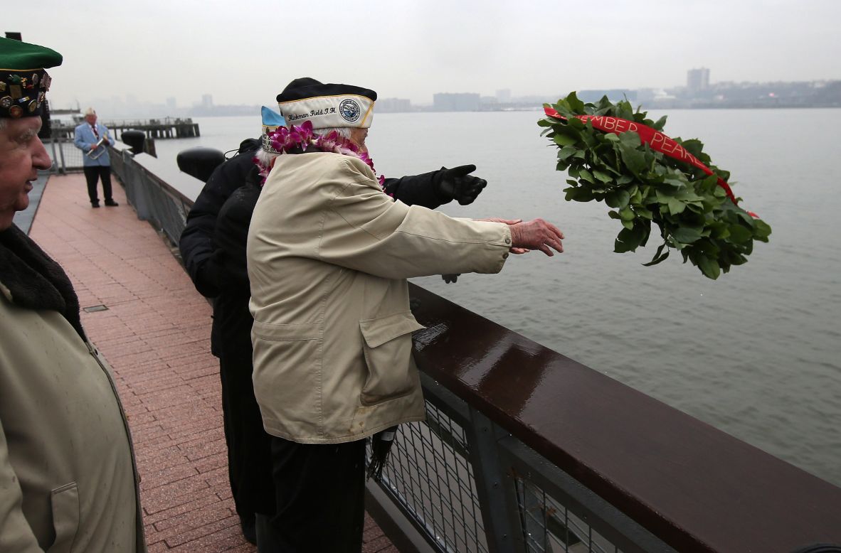 Pearl Harbor survivors throw a wreath into the Hudson River in New York. World War II veterans from the New York metropolitan area participated in a wreath-laying ceremony next to the Intrepid Sea, Air and Space Museum, which was damaged in Hurricane Sandy and is undergoing repairs. 
