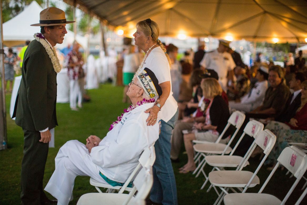 National Parks Service Memorial Superintendent Paul DePrey greets veteran Edgar Harrison of California at the 71st Annual Memorial Ceremony in Pearl Harbor, Hawaii.