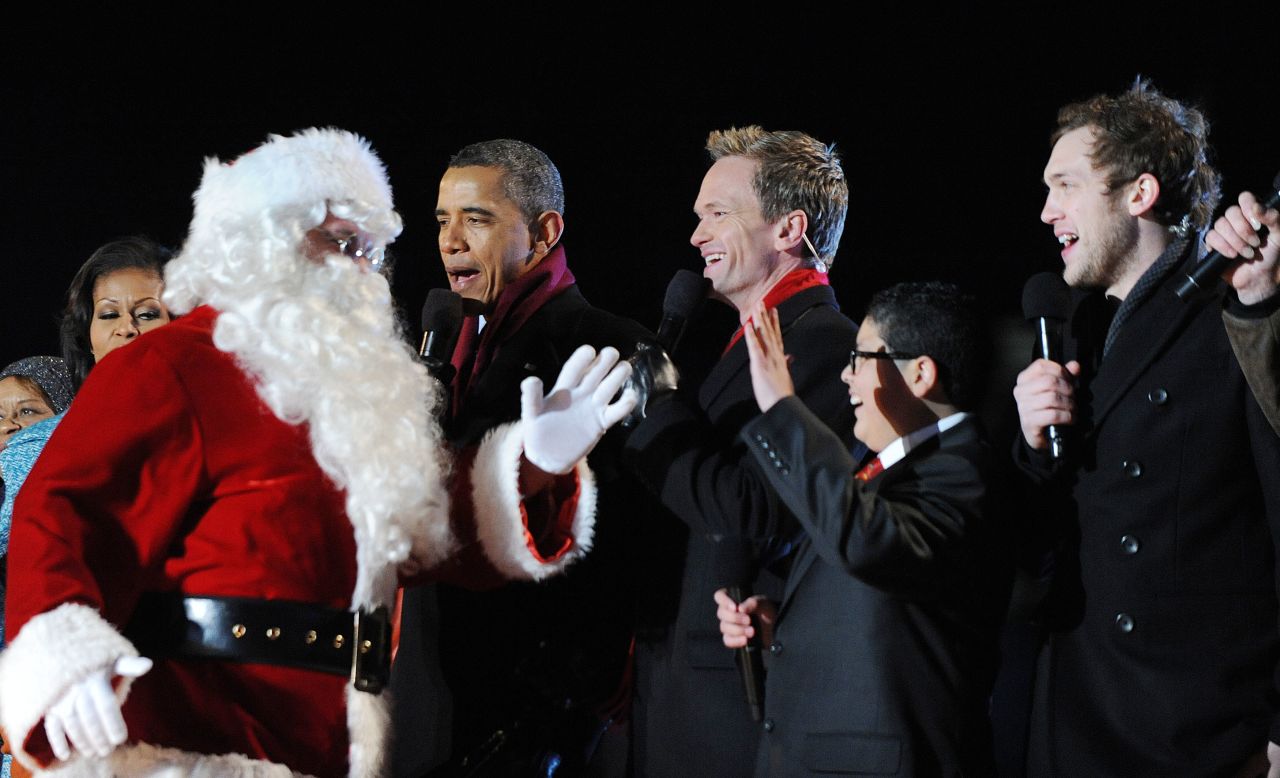 President Barack Obama greets Santa Claus with actors Neil Patrick Harris, Rico Rodriguez and musician Phillip Phillips during the 90th National Christmas Tree Lighting Ceremony at the White House on Thursday, December 6, in Washington, D.C.
