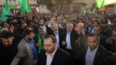 Hamas leader-in-exile Khaled Meshaal and Hamas PM in Gaza Ismail Haniya  wave to supporters in Gaza City, December 7, 2012.