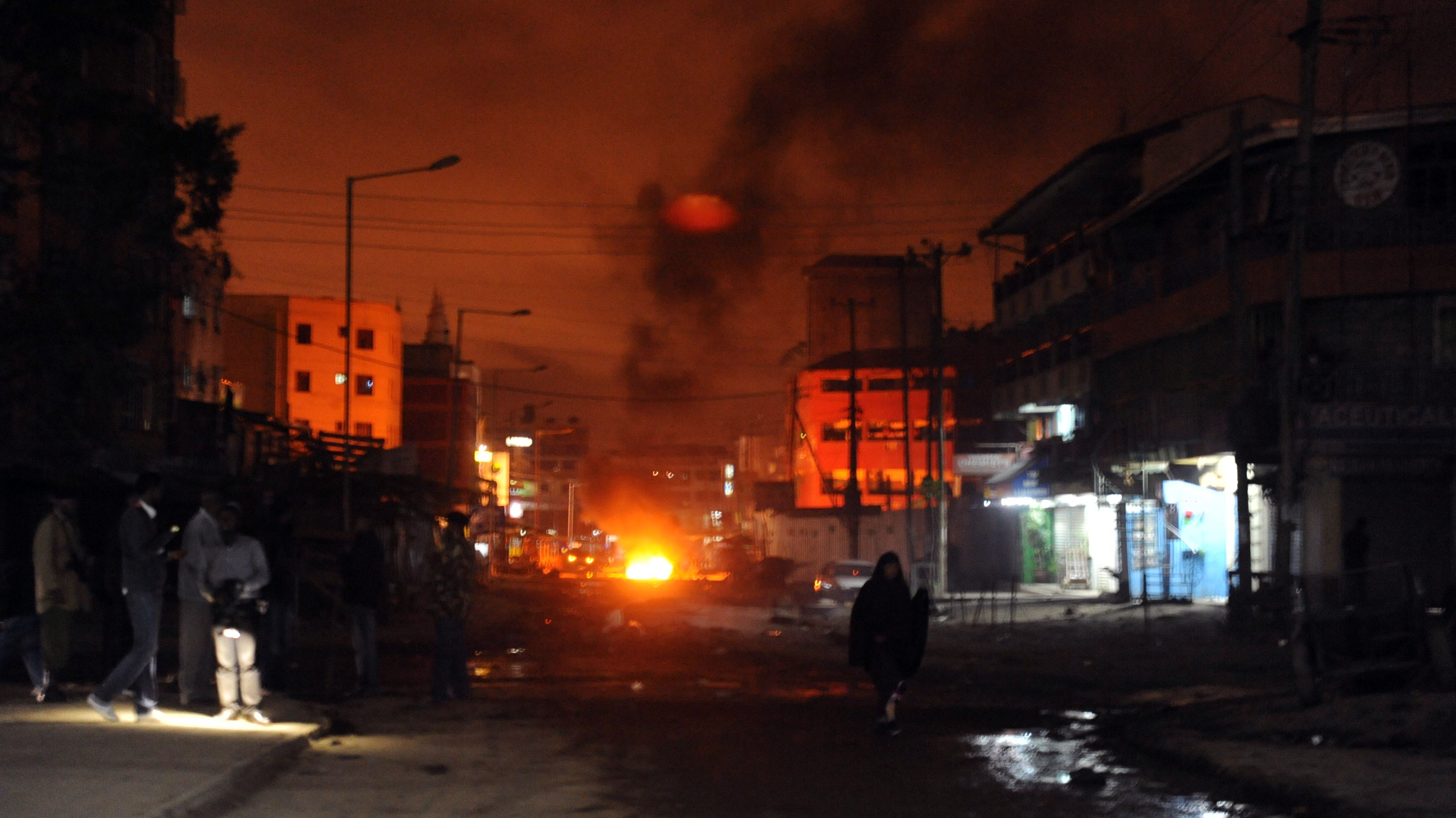 Smoke billows from a fire in a street, on December 7, 2012, following a large explosion outside a mosque in Nairobi. Three people were killed and eight wounded in the blast, the Kenyan Red Cross and police said. The blast followed one in the same neighborhood earlier in the week.