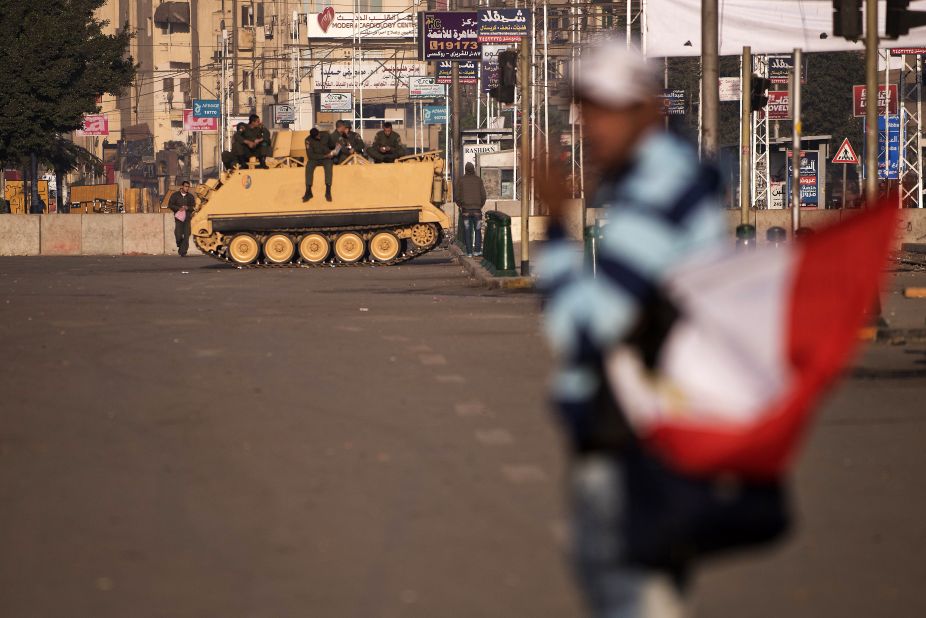 Egyptian soldiers take position on a road leading to the presidential palace on December 8.