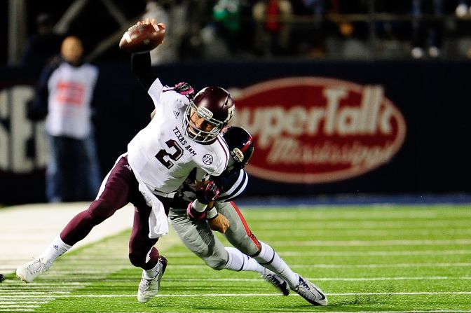 Manziel is tackled by LaKedrick King of the Ole Miss Rebels during a game at Vaught-Hemingway Stadium on October 6 in Oxford, Mississippi.