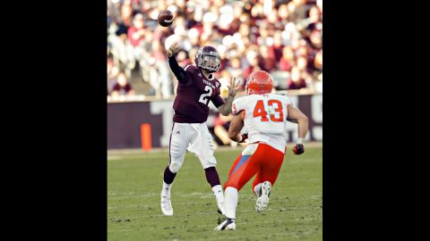 Manziel throws downfield as Jesse Beauchamp of the Sam Houston State Bearkats applies pressure at Kyle Field on November 17.