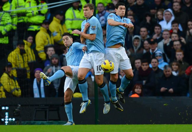 Manchester City midfielder Samir Nasri (left) diverted Van Persie's free kick past Hart as he backed off from his position in the defensive wall.