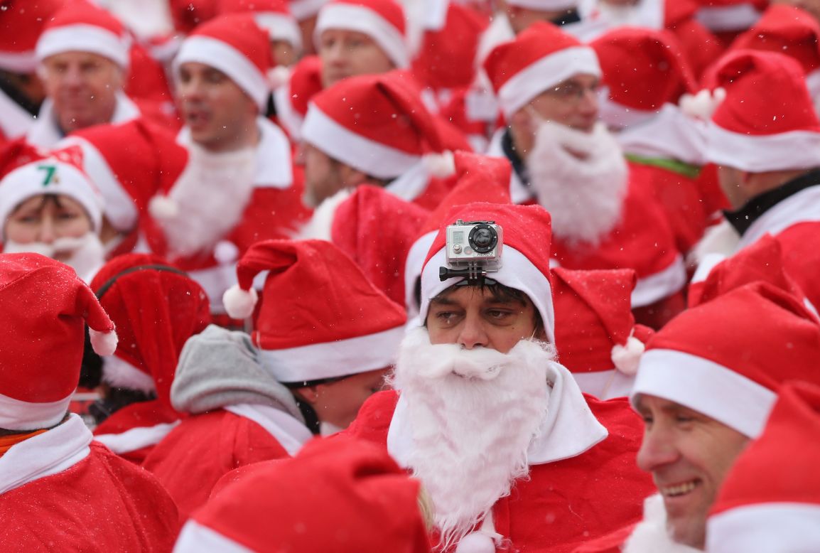 Participants in the fourth annual Michendorf Santa Run, one wearing a camera on his head, gather shortly before the run on December 9 in Michendorf, Germany. More than 800 people took part in this year's races.