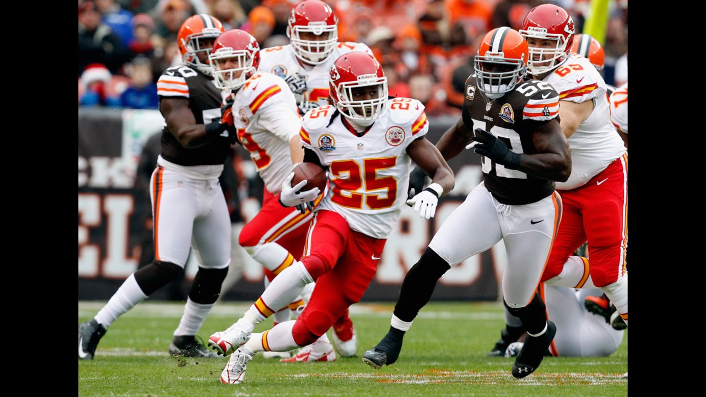 Running back Jamaal Charles of the Kansas City Chiefs scores a touchdown as he runs by linebacker D'Qwell Jackson of the Browns on Sunday.
