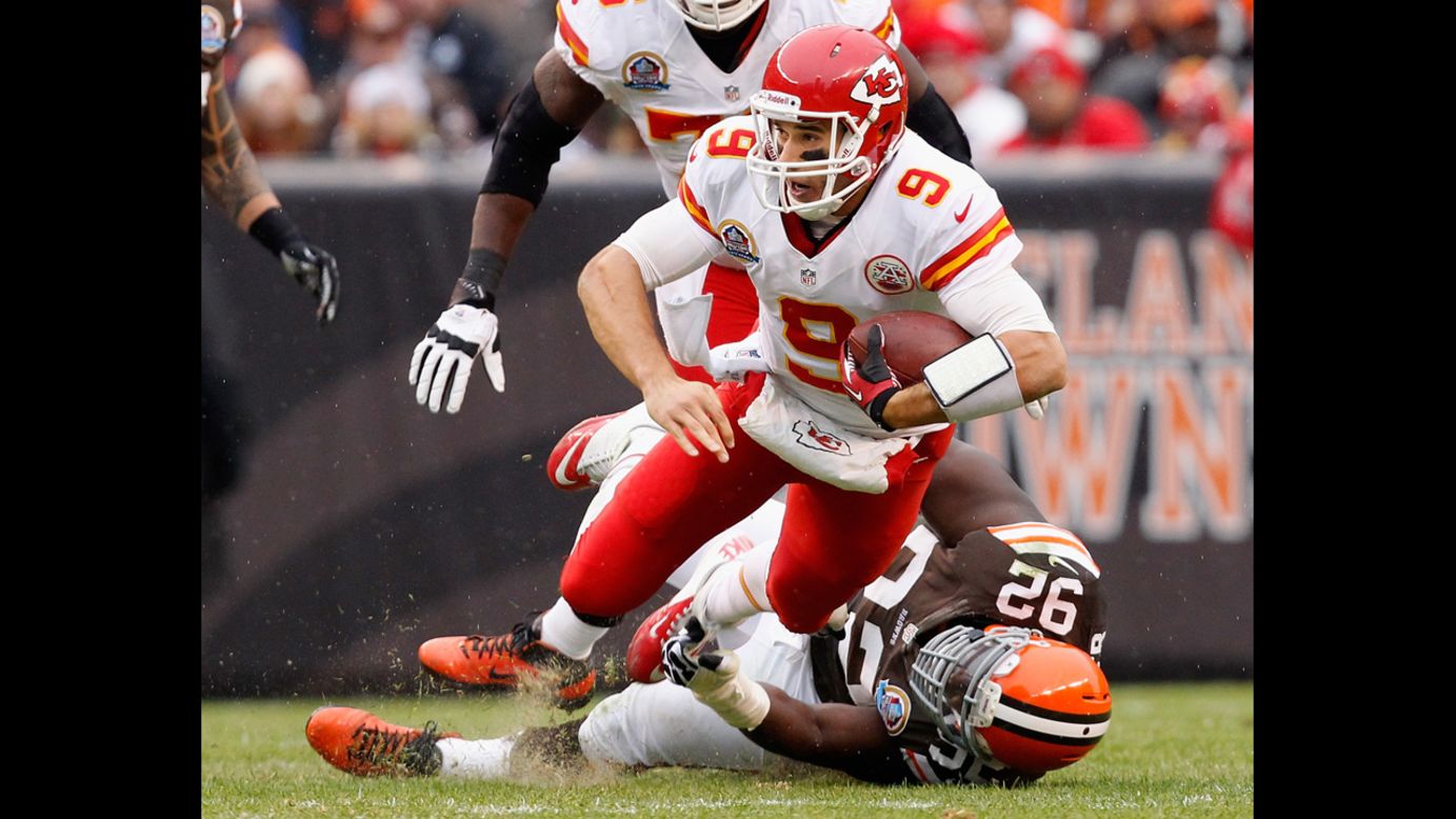 Quarterback Brady Quinn of the Chiefs is sacked by defensive lineman Frostee Rucker of the Browns on Sunday.