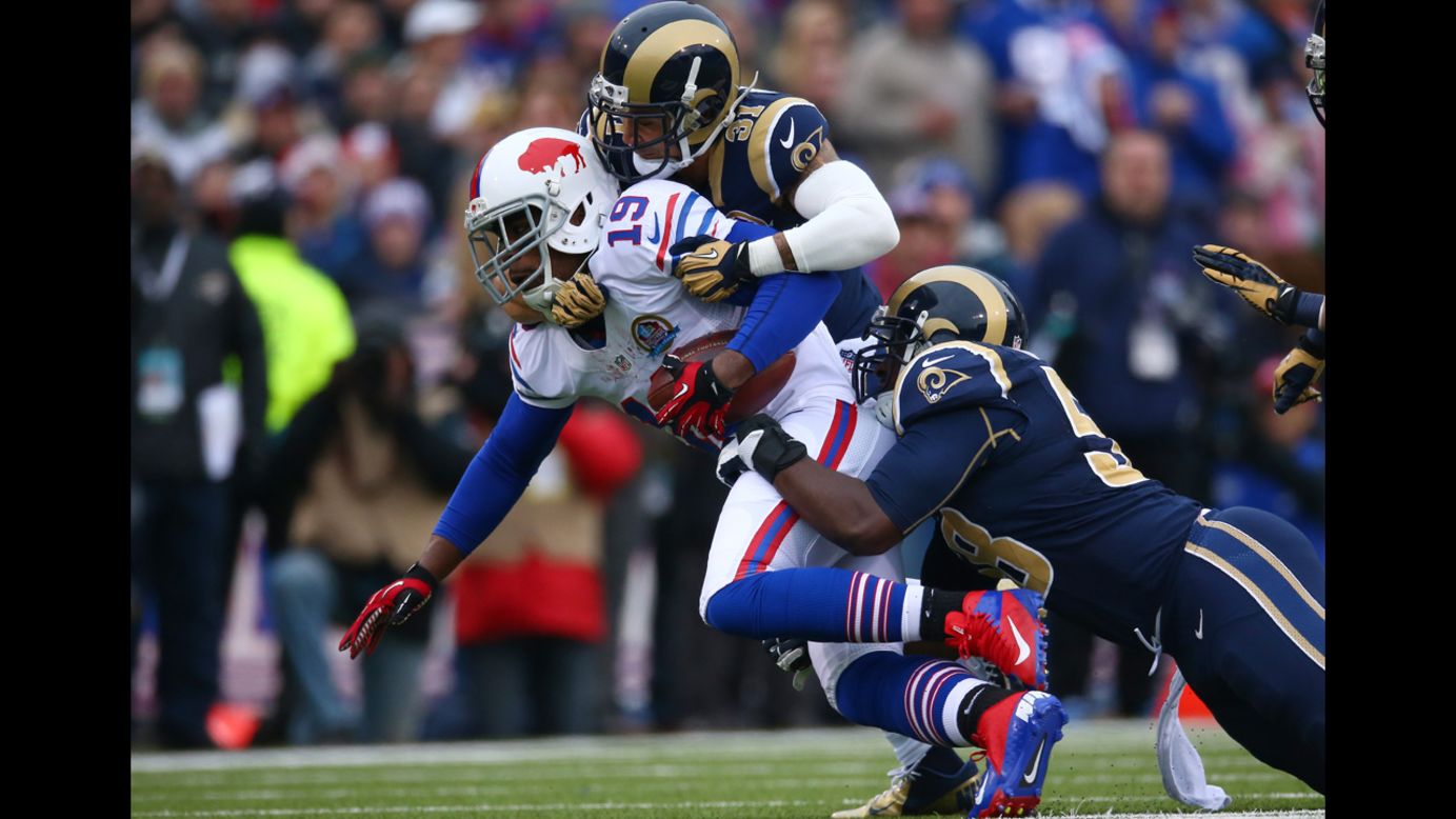 Bills wide receiver Donald Jones is tackled by Cortland Finnegan of the Rams on Sunday.
