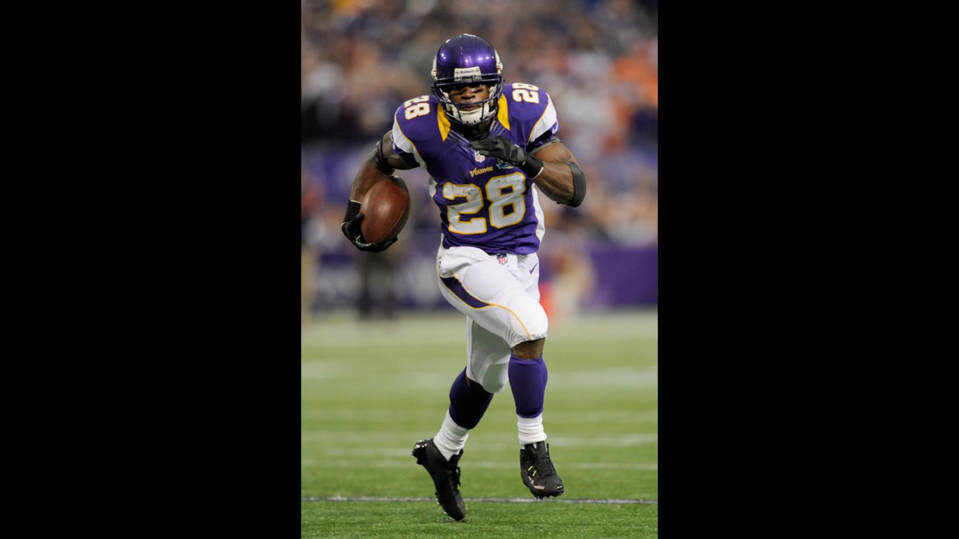 Adrian Peterson carries the ball during the first quarter against the Bears on Sunday.