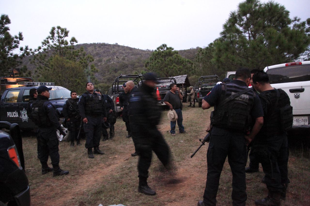Federal police work near the site of the plane crash in Iturbide, Mexico. "The aircraft was destroyed, totally fragmented," an aviation official told CNN affiliate Televisa. Six others were killed, including the singer's publicist, attorney and makeup artists, her brother Gustavo Rivera told CNN en Espanol.
