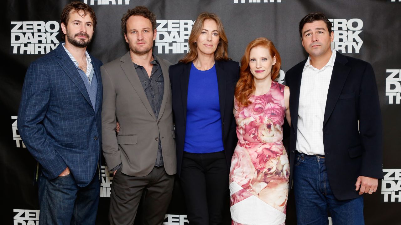 Screenwriter Mark Boal, left, and director Kathryn Bigelow, center, pose with cast members of "Zero Dark Thirty."