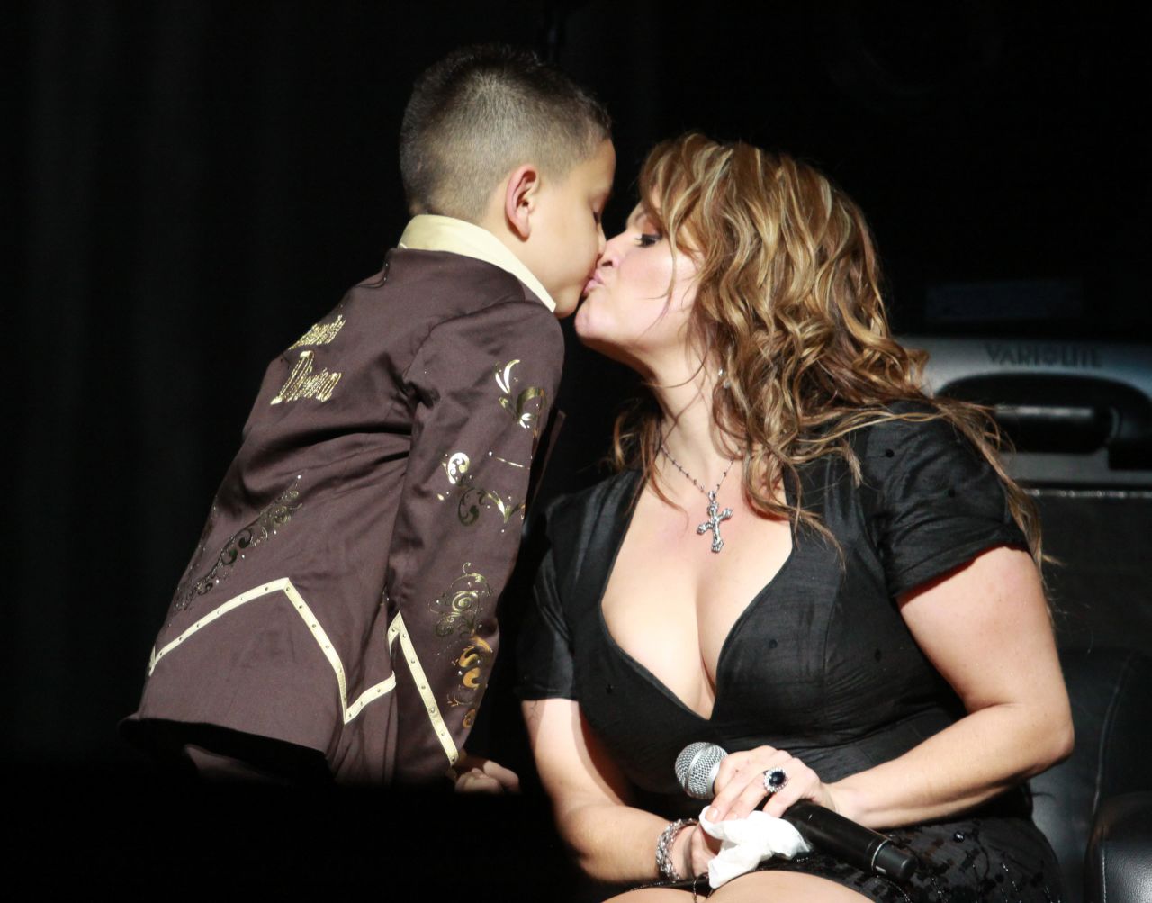 The singer kisses her son during a July 2009 concert in Los Angeles.