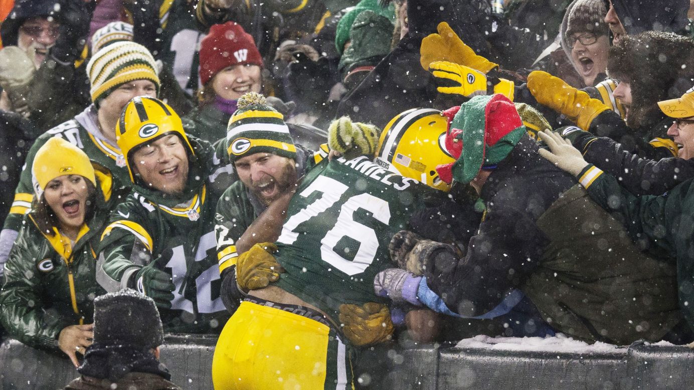 Mike Daniels of the Green Bay Packers does a "Lambeau Leap" after he scored a touchdown on a fumble recovery on Sunday.