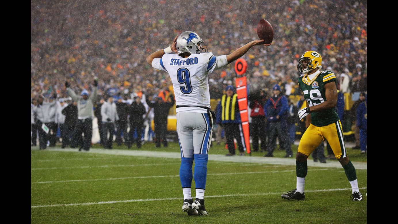 Lions quarterback Matthew Stafford celebrates in the end zone on Sunday.