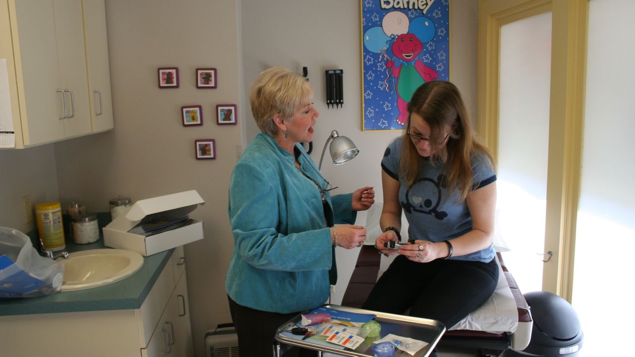 Volunteer diabetes educator B.J. Cline and patient Katie Lipsey at a Church Health Center clinic.