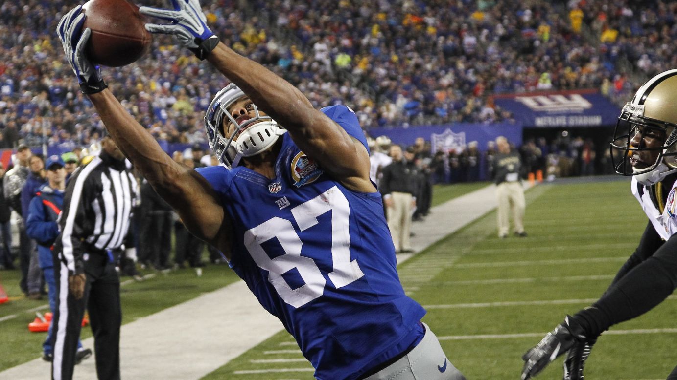 New York Giants wide receiver Domenik Hixon pulls in a pass for a touchdown in front of Jabari Greer of the New Orleans Saints at MetLife Stadium on Sunday, December 9, in East Rutherford, New Jersey.