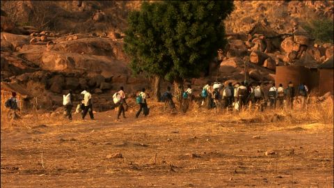 In the film "Erasing the Nuba" Rwandan-born journalist Yoletta Nyange documented the plight of the Nuba people. In this scene from the film, a column of refugees flees to the Yida refugee camp in South Sudan.