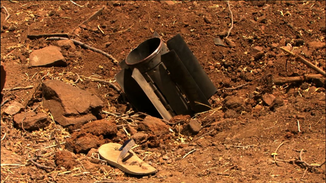 Nyange says this scene from the documentary shows a rocket fired by the Sudanese military, which fell inside a compound that housed a Nuba family.