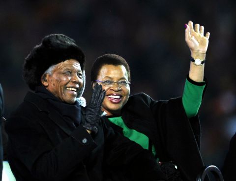 Nelson Mandela and his third wife, Graca Machel, arrive at the 2010 World Cup before the final match between Netherlands and Spain on July 11, 2010, at Soccer City Stadium in Soweto.